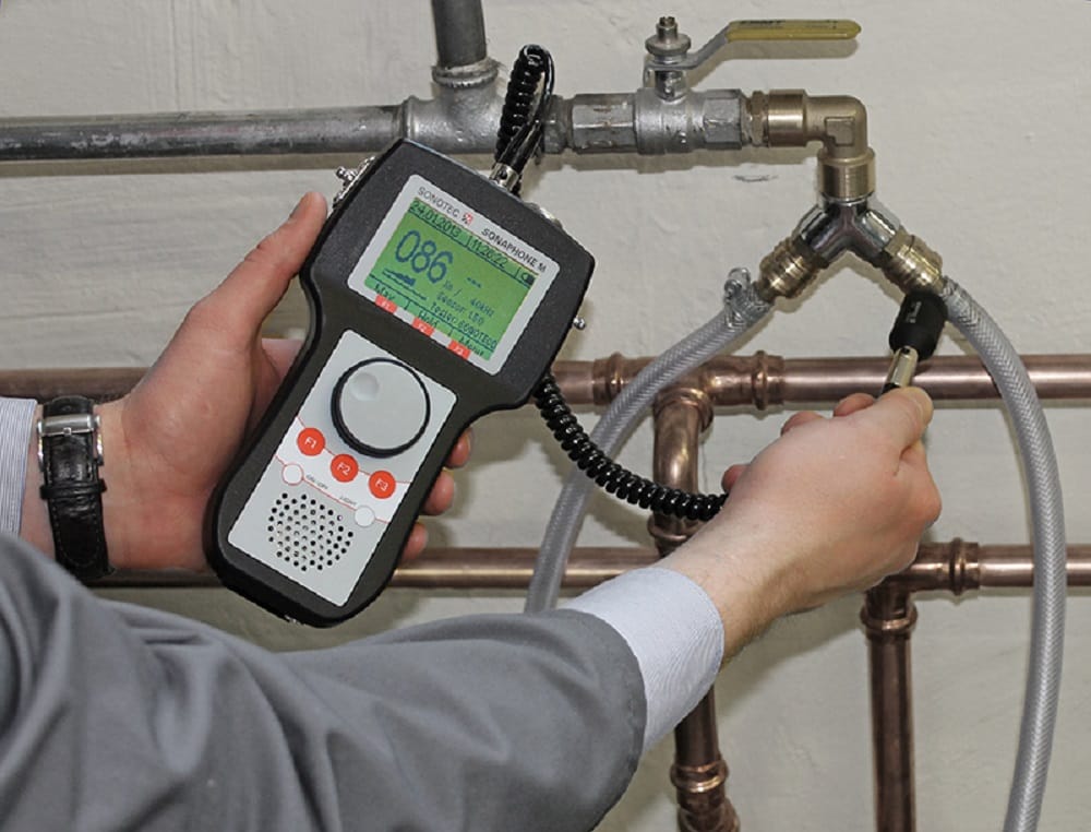 Plumber testing pipes with electronic leak detection equipment in Sebastian